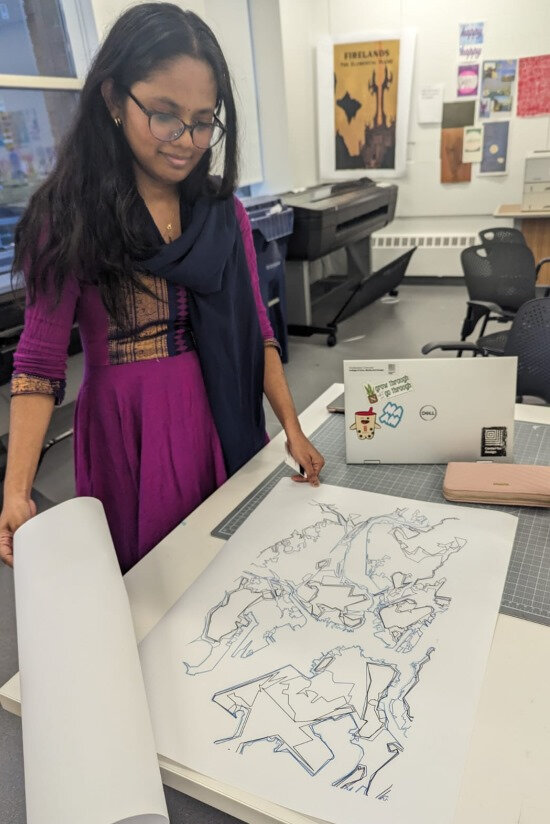 Priyanka with the large printed and traced master drawing of Boston Harbor